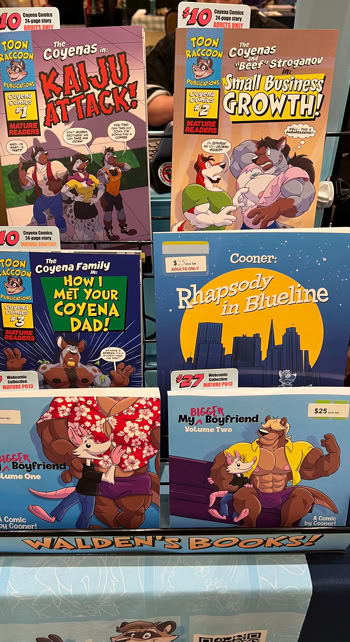 Bookrack of available comics and books, Texas Furry Fiesta '26